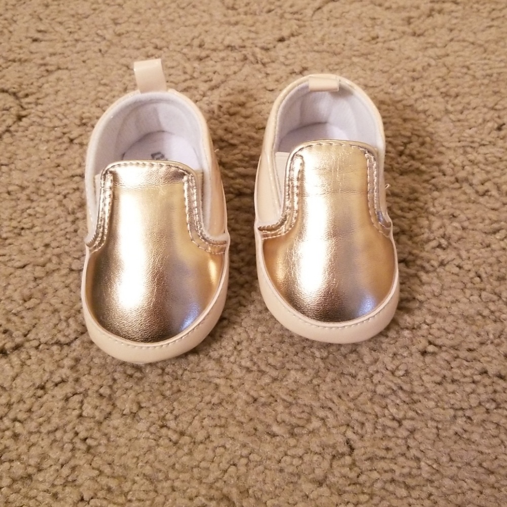 Gold and tan infant slip on.